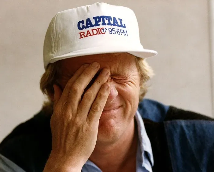 Framed Print : Chris Tarrant radio and TV presenter wearing one of his two hats during interview