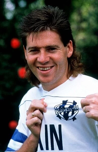 Chris Waddle shows off the Marseille badge after his transfer from Tottenham Hotspur for