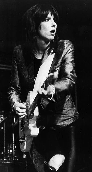 Chrissie Hynde singer with The Pretenders pop group 1982 playing guitar in concert