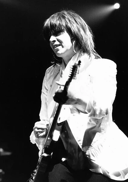 Chrissie Hynde singer with The Pretenders pop group 1987 playing guitar in concert