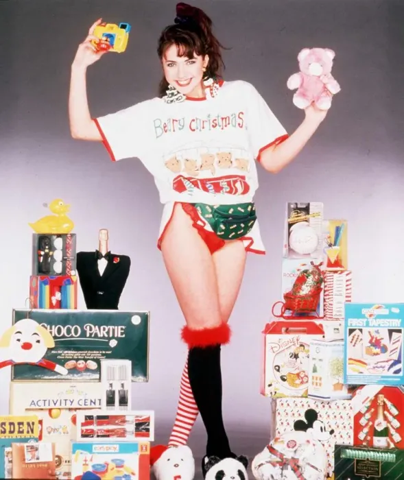 Framed Print : Christmas model surrounded with present ideas for Christmas, 5th December 1989 Framed Print : Christmas model surrounded with present ideas for Christmas, 5th December 1989