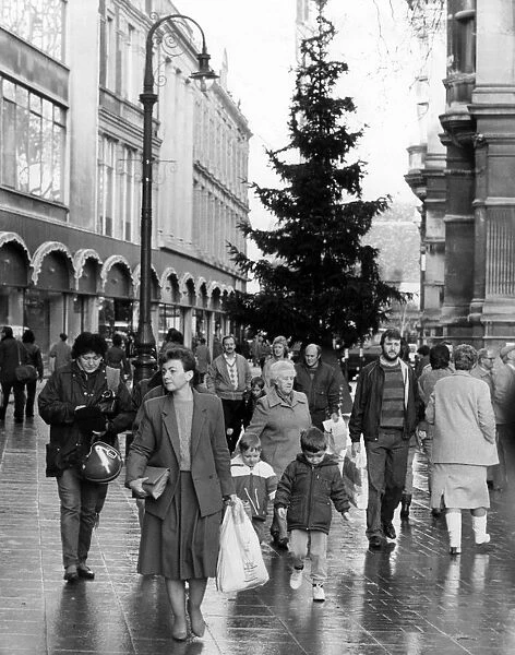 Christmas shoppers, out in Cardiff, Wales, 13th December 1986. Near Central Library