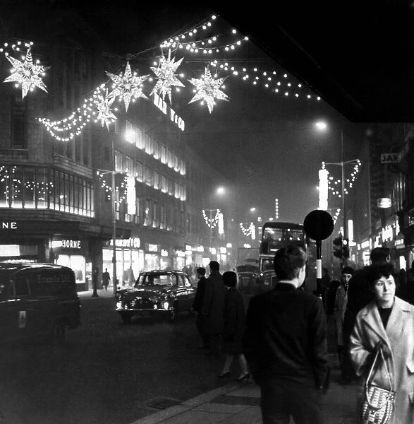 Christmas shopping as shimmering Stars hang over Lord Street in Liverpool, Merseyside