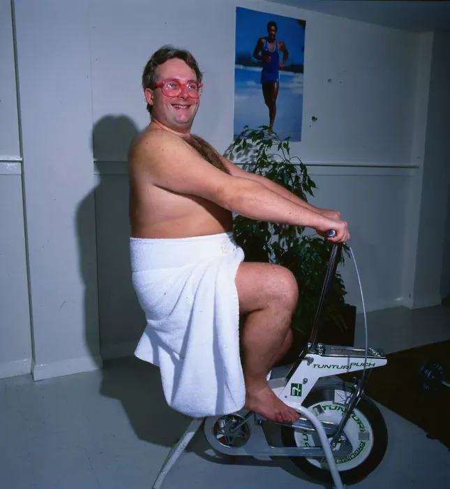 Framed Print : Christopher Biggins 1985 on exercise bicycle gymnasium Framed Print : Christopher Biggins 1985 on exercise bicycle gymnasium