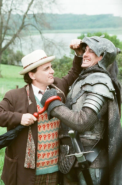 Christopher Bowen as Mordred crosses swords with Sylvester McCoy as the Doctor whilst