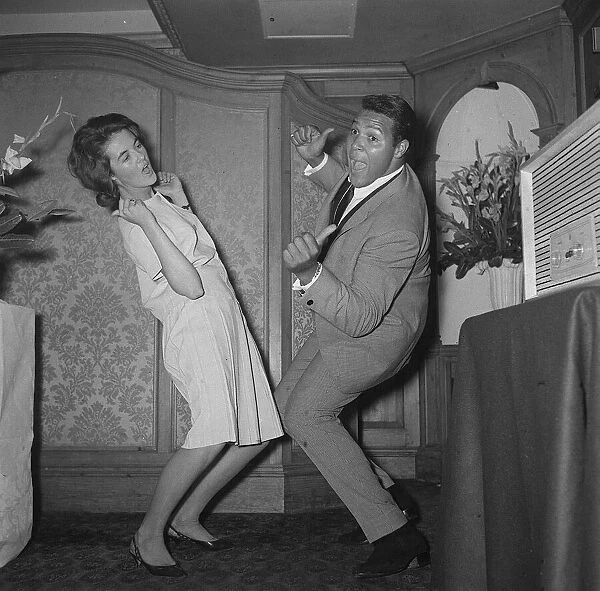 Chubby Checker showing how its really done - The Twist that is with a female