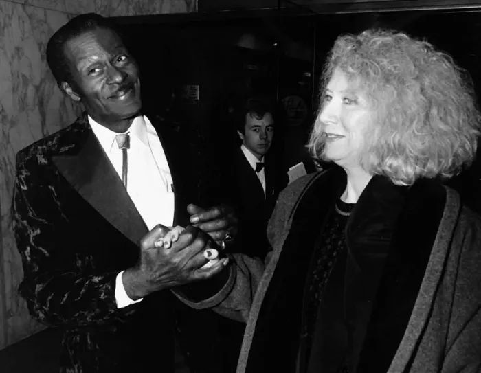 Framed Print : Chuck Berry greets woman at film premiere 1988 Holding hands