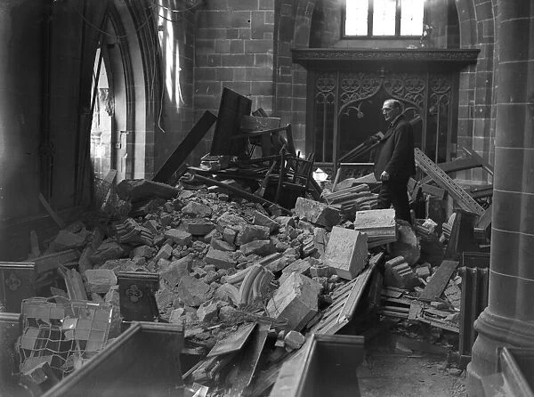 One of the church wardens surveys the damage to St Martins Church in the Bull Ring