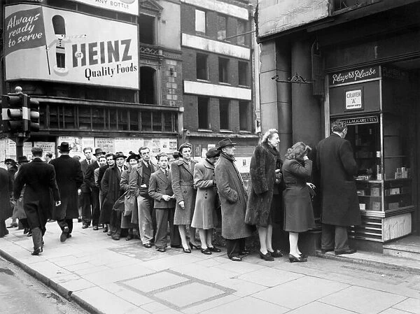 The Cigarette Queue - The cigarette supply has arrived at this Oxford Street kiosk