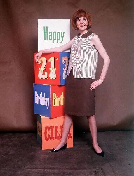 Cilla Black Singer poses in a studio for a photo on her 21st birthday in May 1964