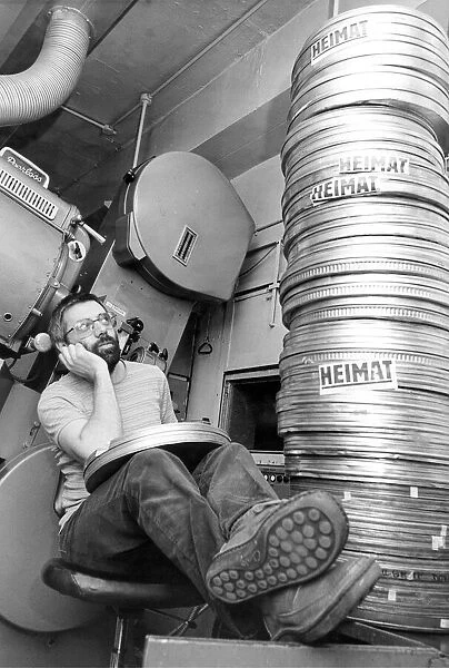 Cinema projectionist Ray Reed at the Tyneside Cinema with the longest feature film ever