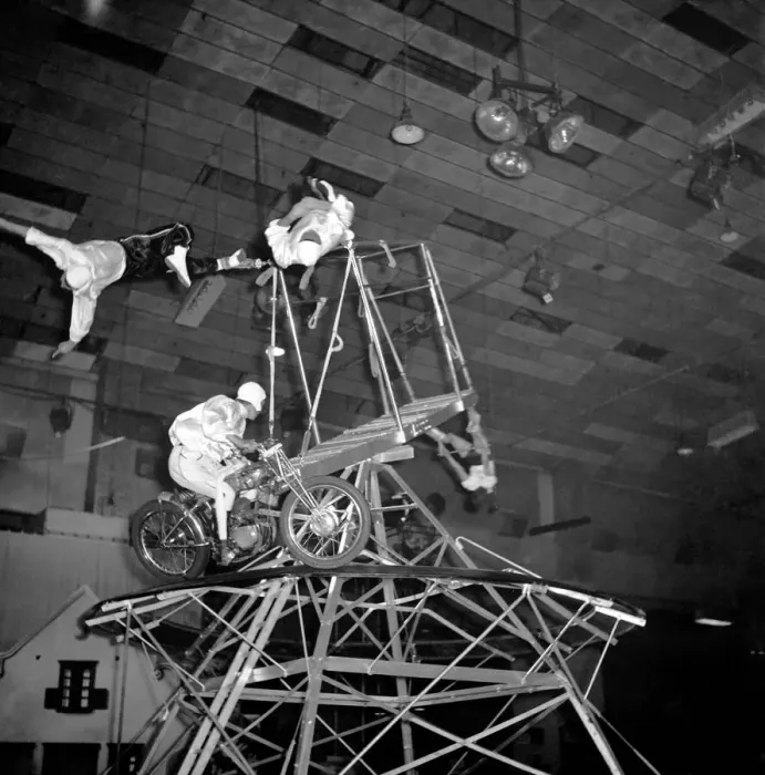 Framed Print : A circus novelty act based on the motorcycle wall of death combined with acrobats Framed Print : A circus novelty act based on the motorcycle wall of death combined with acrobats