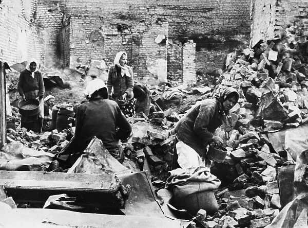 Civilians in Russia amongst ruins after an Air raid during the Second World War