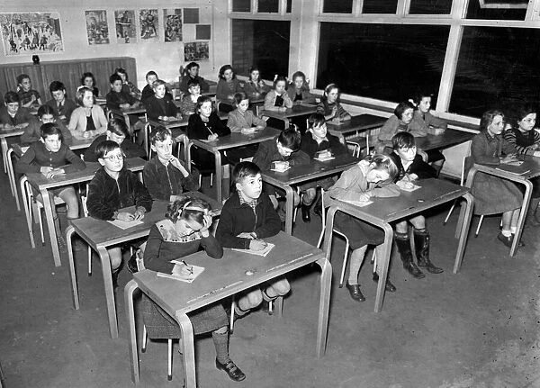 A class at Poundwick junior School in Woodhouse Park sit for their Grammar School