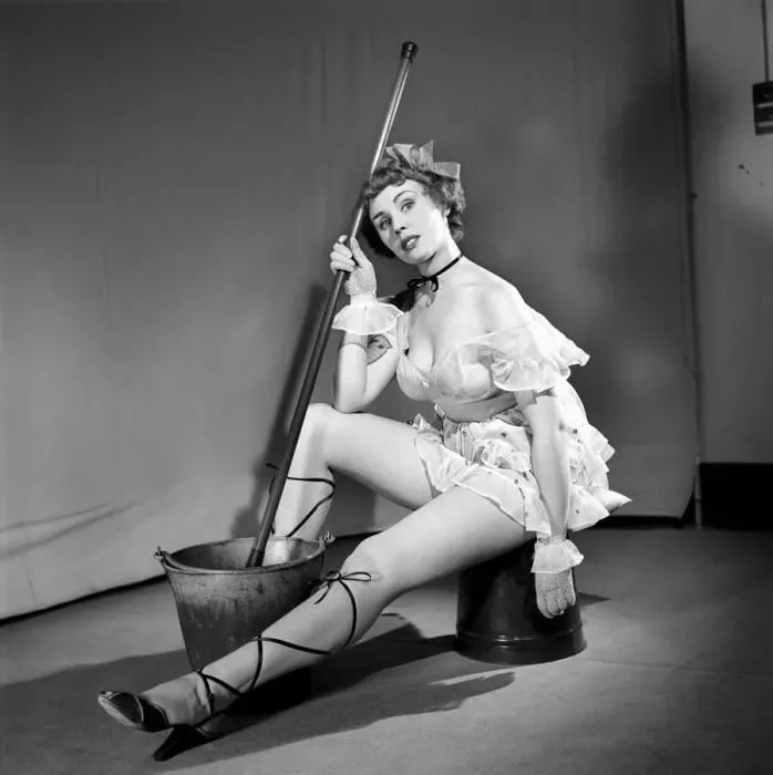 Framed Print : Cleaner wearing fancy dress. 1966 E25-009