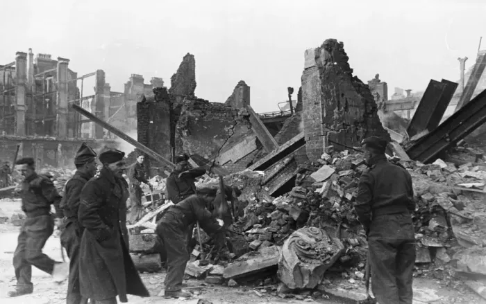Framed Print : Clearing away rubble at a scene of destruction in London following an air raid during Framed Print : Clearing away rubble at a scene of destruction in London following an air raid during