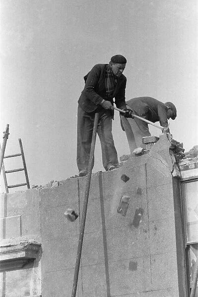Clearing bomb damage buildings in Bromley by Bow. 3rd March 1955