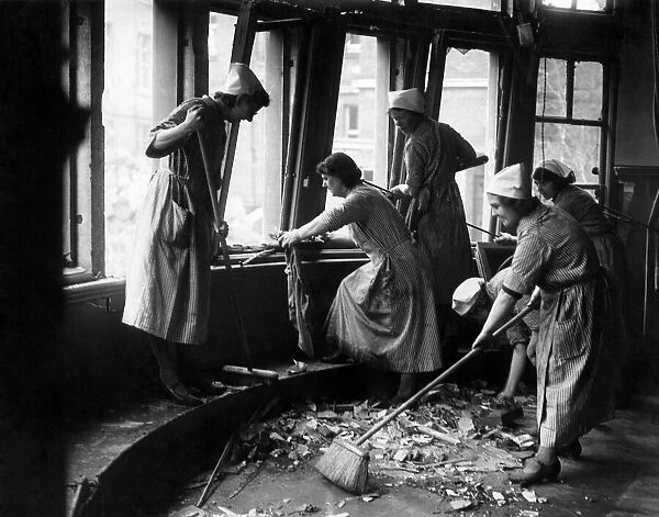 Clearing up the bombed nurses home during the Blitz. December 1940, P012278