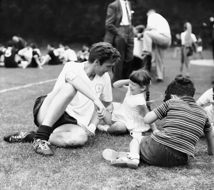 Framed Print : Cliff Jones of Tottenham Hotspur with children during a training session at Cheshunt Framed Print : Cliff Jones of Tottenham Hotspur with children during a training session at Cheshunt
