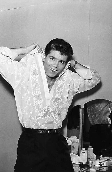 Cliff Richard Actor  /  Singer wearing a shirt made from pineapple leaves. June 1961