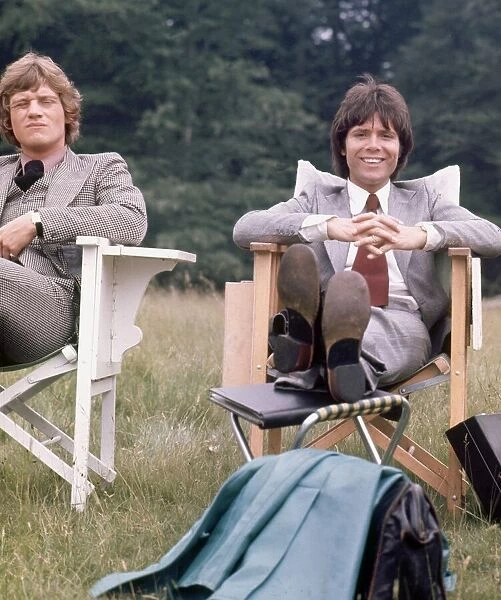 Cliff Richard and Anthony Andrews seen here relaxing between takes on location filming