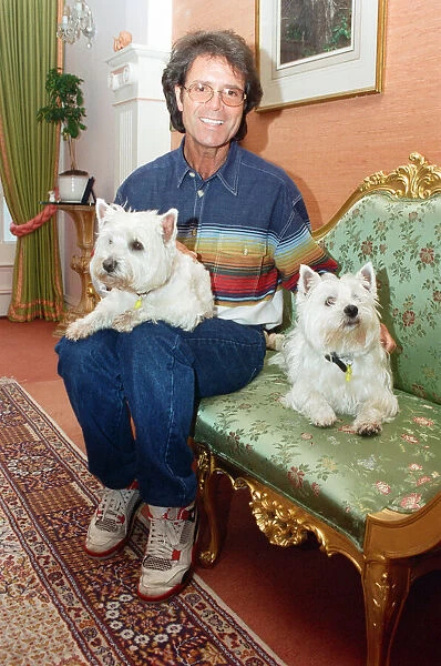 Cliff Richard with his two dogs. 17th June 1995