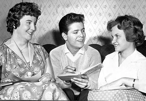 Cliff Richard, pictured with two of his fans, backstage at the Coventry Theatre