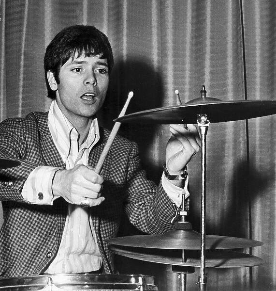 Cliff Richard, singer, in a new roll - as drummer for the Shadows at the Talk of the Town