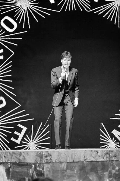 Cliff Richard singing on stage during the Eurovision Song Contest rehearsals at Albert