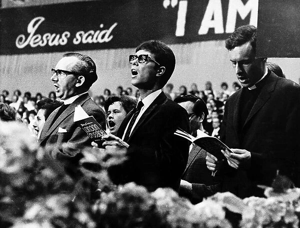 Cliff Richard sings for Billy Graham at a Christian rally in Earls Court