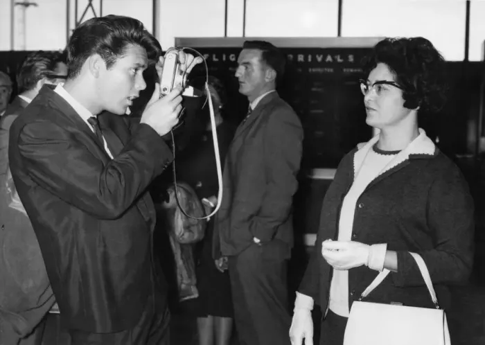 Framed Print : Cliff Richard taking a picture of his Mother at London Airport before leaving for New Framed Print : Cliff Richard taking a picture of his Mother at London Airport before leaving for New