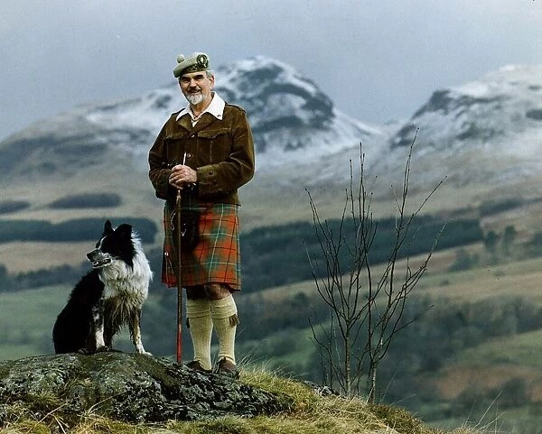 Climber Sandy Cousins with collie dog in the Highlands 1994