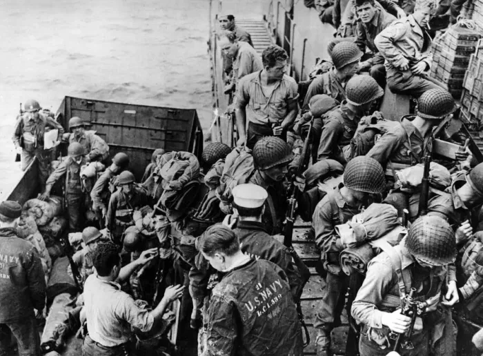 Framed Print : Climbing out of an LCVP (Landing Craft, Vehicle Personnel) U
