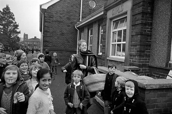 Clitheroe School Strike. Teacher Miss Kianne Kay surrounded by pupils as she returns to
