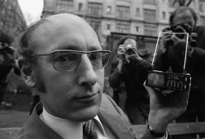 Framed Print : Clive Sinclair holding the first pocket sized television Framed Print : Clive Sinclair holding the first pocket sized television