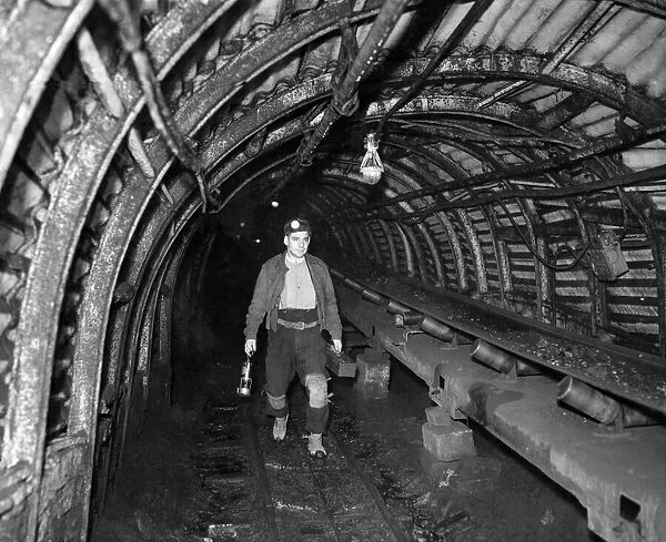 Cliviger colliery, near Burnley. Albert Smith a Deputy walks the mile to the coal face