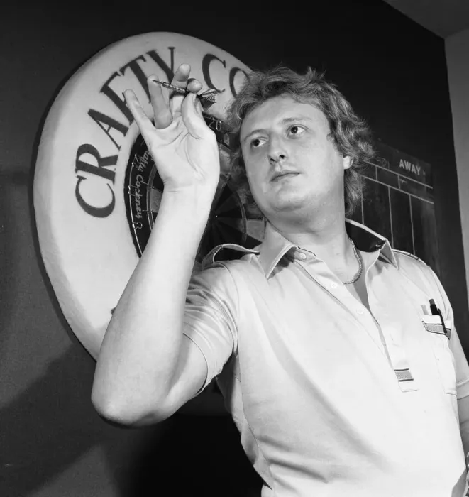 Framed Print : Close up feature on British darts player Eric Bristow in dart throwing action Framed Print : Close up feature on British darts player Eric Bristow in dart throwing action