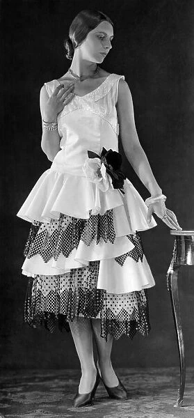 Clothing 1926-1929: A magpie evening gown in ivory faille and black cire lace