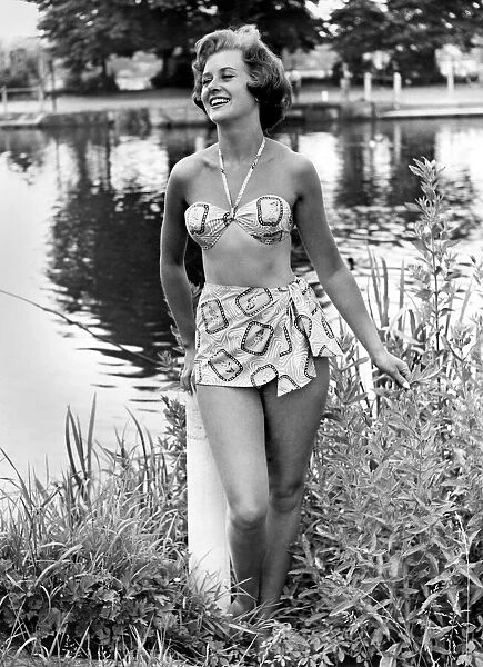 Clothing Beach: Casino Bikini. Swimwear. Swimming costume. Model stands by a lake