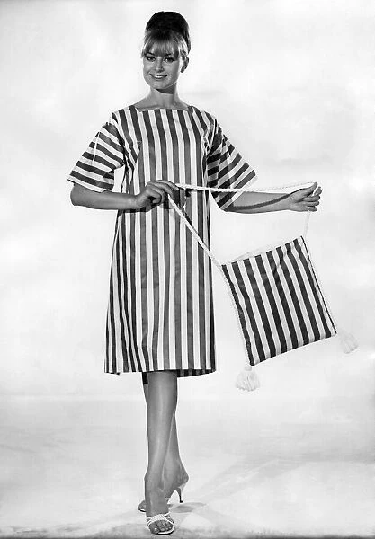 Clothing Beach. Striped beach dress and matching bag. July 1964 P017999