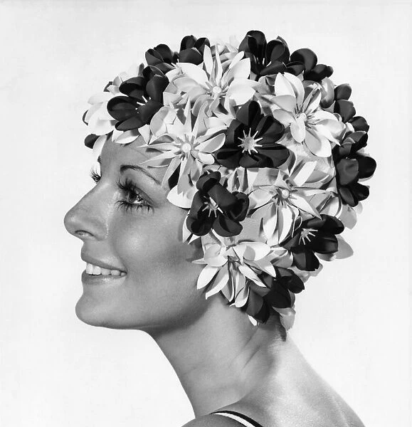Clothing Beach. Woman models swimming hat covered in flowers