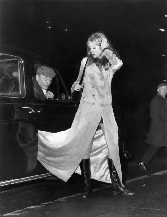 Framed Print : Clothing Coats: The current British fashion of wearing maxi coats has revealed many Framed Print : Clothing Coats: The current British fashion of wearing maxi coats has revealed many