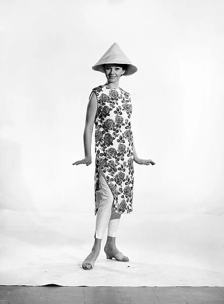 Clothing: Fashion: Beachwear: Woman wearing bathing dress and cap. Model: Meriel Weston