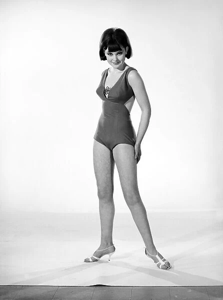 Clothing: Fashion: Beachwear. Woman wearing swimming costumes. Model: Debbie Attwood