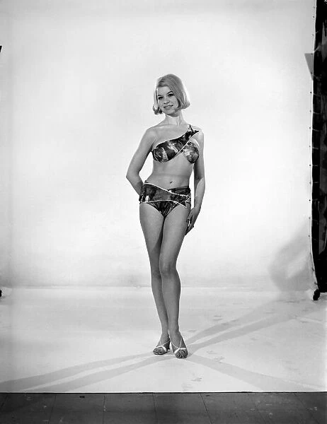 Clothing: Fashion: Beachwear: Woman wearing fish bikini. 1965 B1889a-001