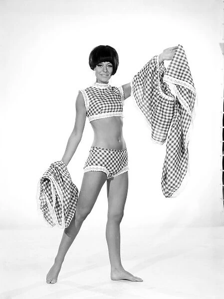 Clothing: Fashion: Dress: Woman wearing gingham dress. 1966 B2008-011