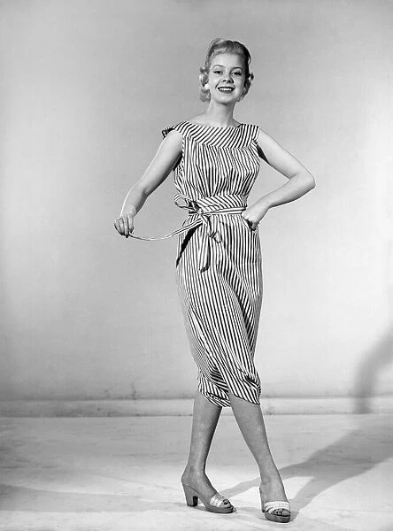 Clothing: Fashion: Dresses: Woman wearing reversible dress. 1957 B303-001