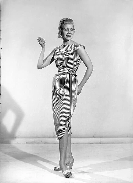 Clothing: Fashion: Dresses: Woman wearing reversible dress. 1957 B303-002