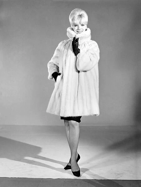 Clothing: Fashion: Fur Coat: Woman (Marion Horton) wearing mink fur coat. 1966 B1952-002