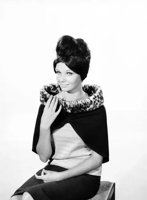 Framed Print : Clothing: Fashion: Hats: Woman wearing fur edged shrug wrap. 1962 B1544-030